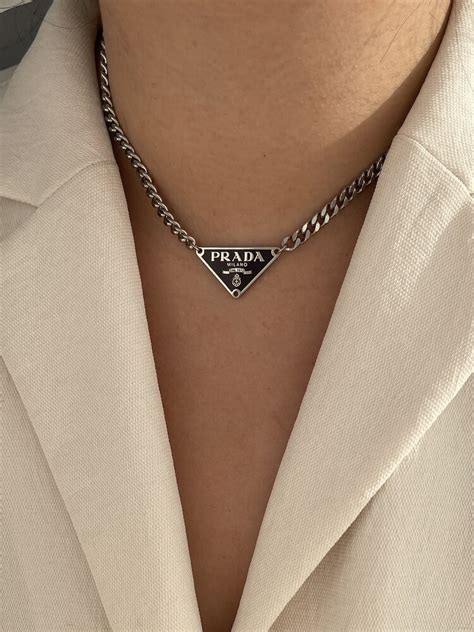 prada necjlace|Prada symbol necklace.